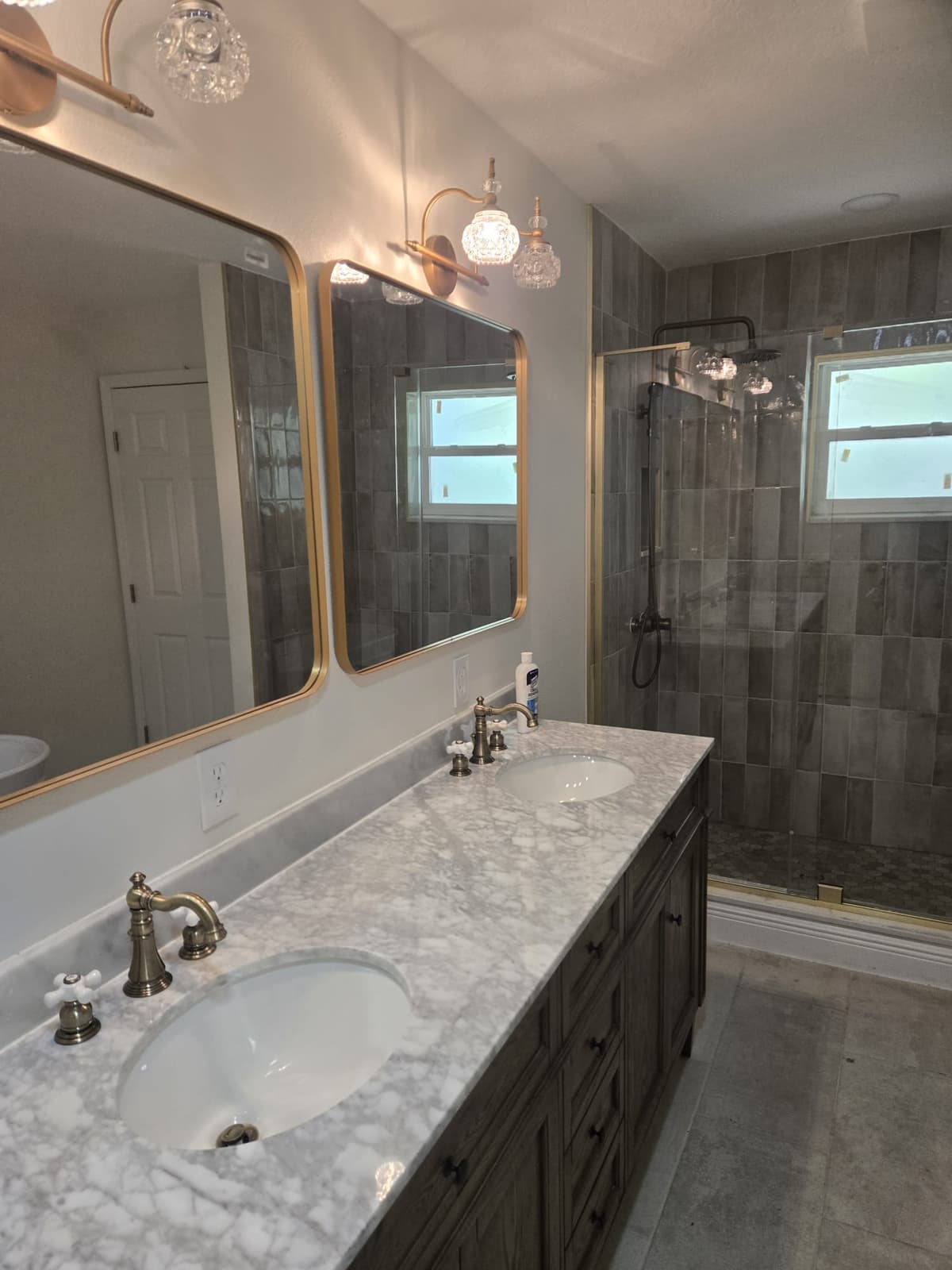Double vanity and tile walk-in shower