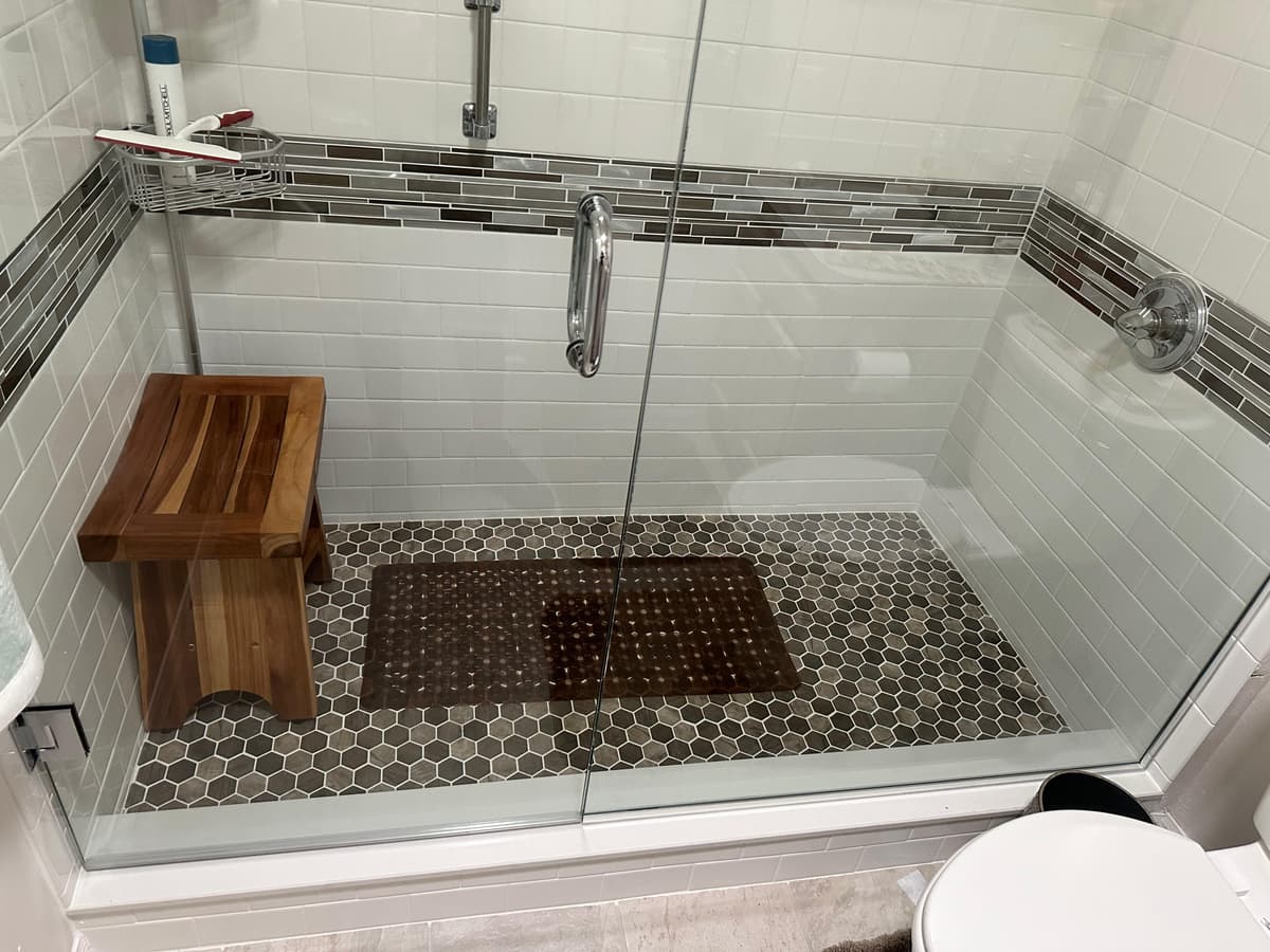 Luxury bathroom with subway tiles and custom bench